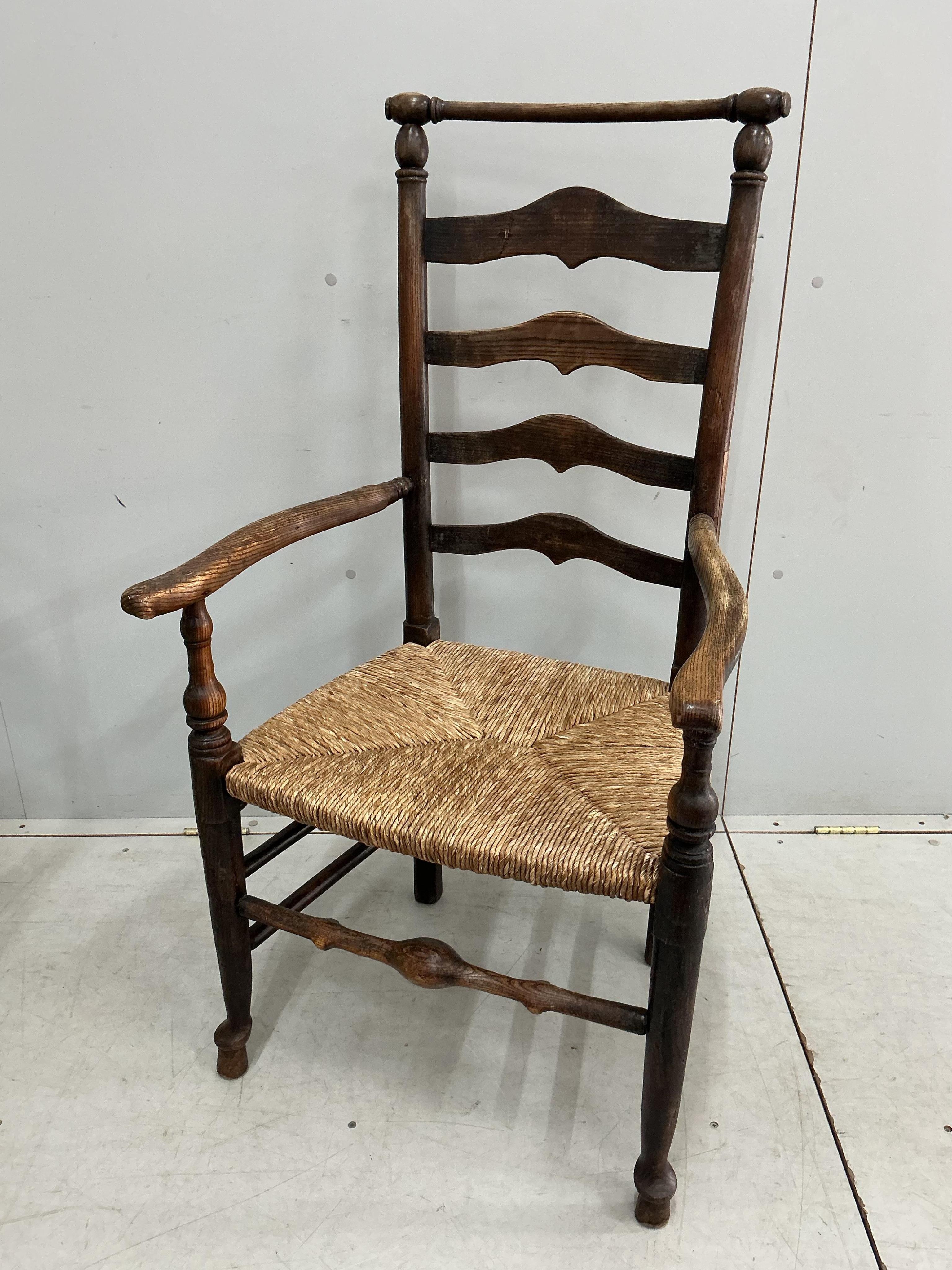 A harlequin set of eight 18th century ash ladderback rush seat dining chairs, two with arms